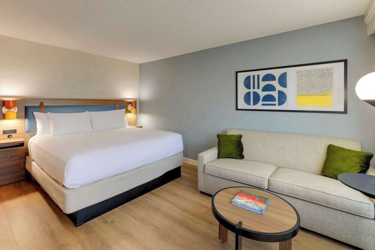 Premium bedding, desk, laptop workspace, blackout drapes