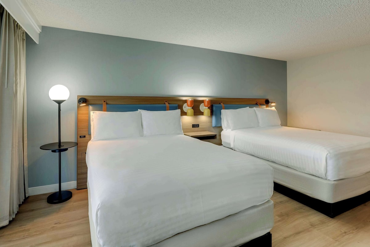 Premium bedding, desk, laptop workspace, blackout curtains