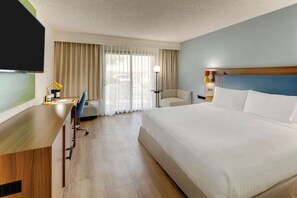 Premium bedding, desk, laptop workspace, blackout curtains