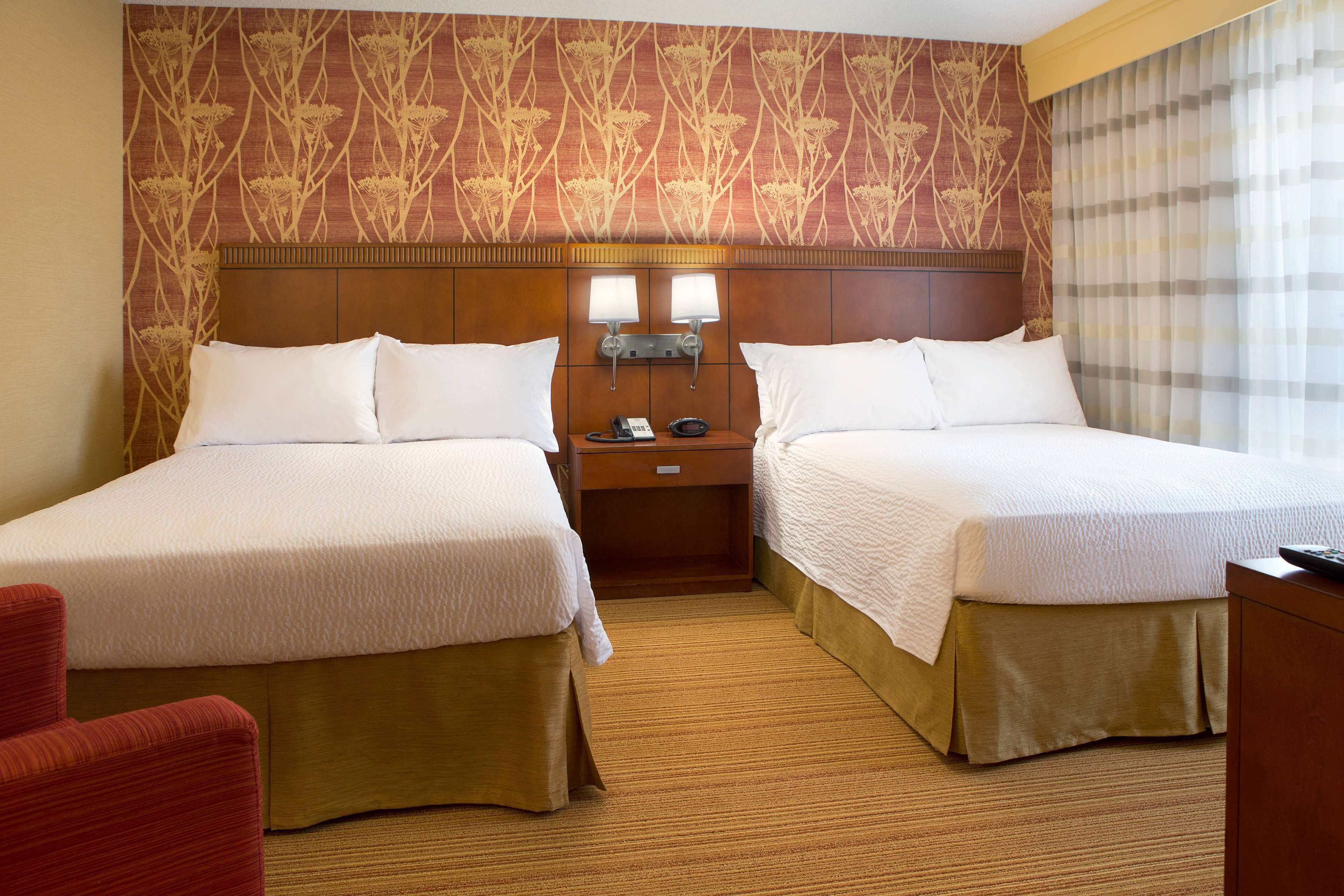 Premium bedding, desk, laptop workspace, blackout drapes
