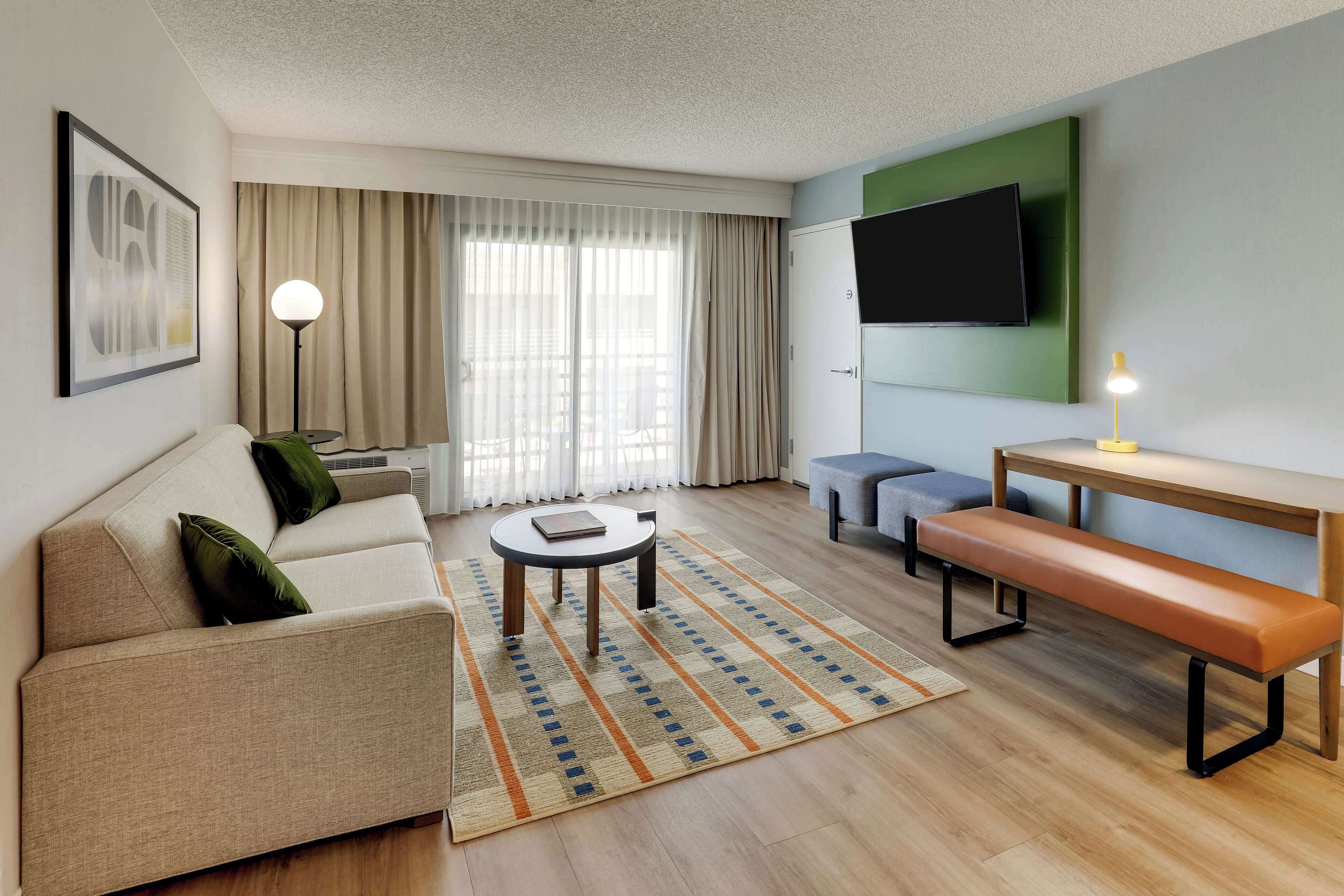 superior suite, multiple beds (one bedroom) | living area | 55-inch tv with cable channels