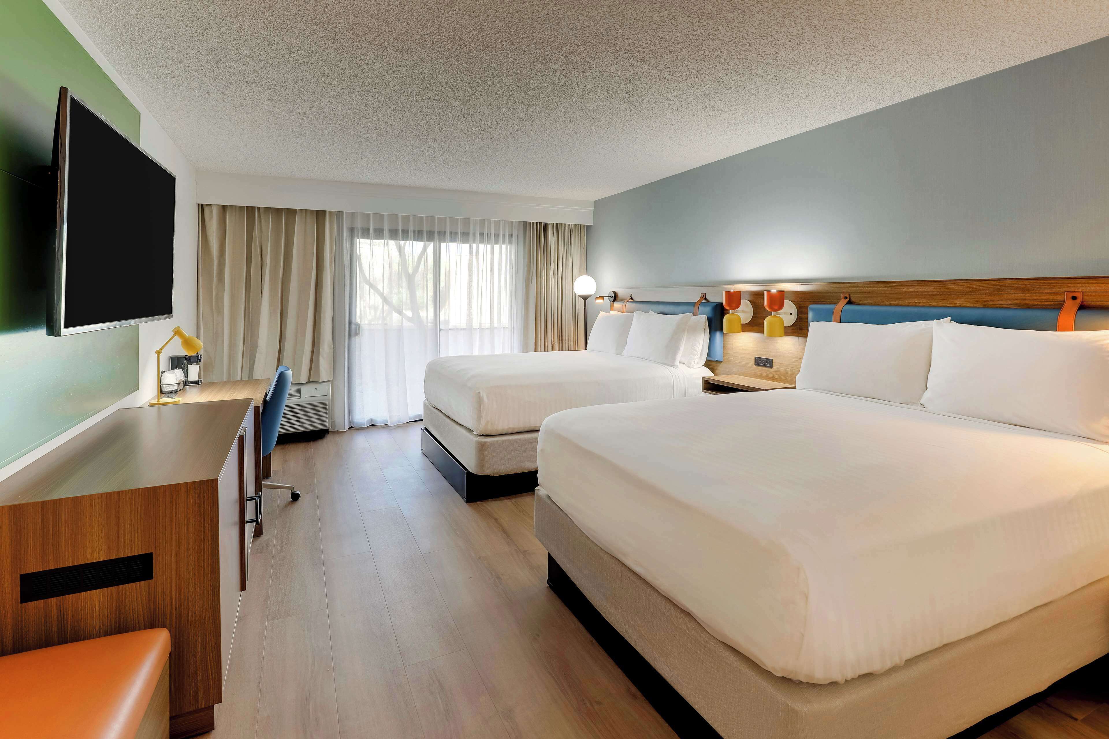 premium bedding, desk, laptop workspace, blackout curtains