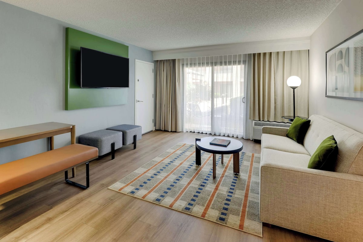 Superior Suite, 1 King Bed with Sofa bed (One Bedroom) | Living area | 55-inch TV with cable channels