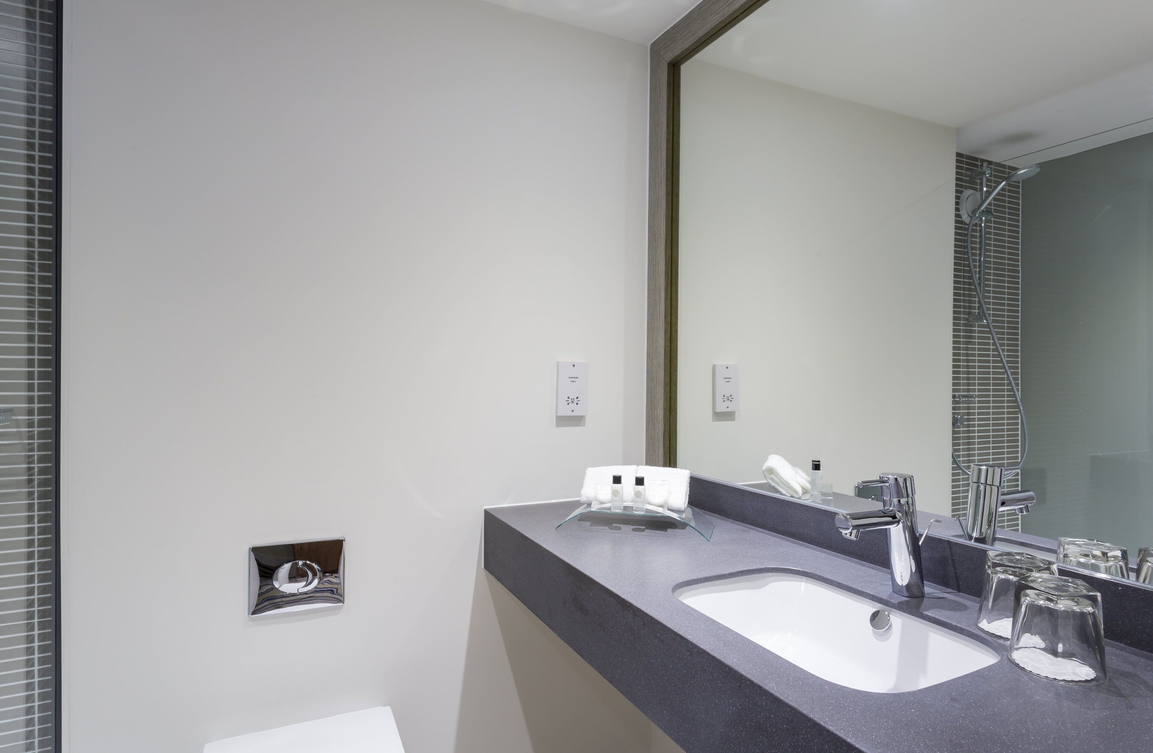 rainfall showerhead, eco-friendly toiletries, hair dryer, towels