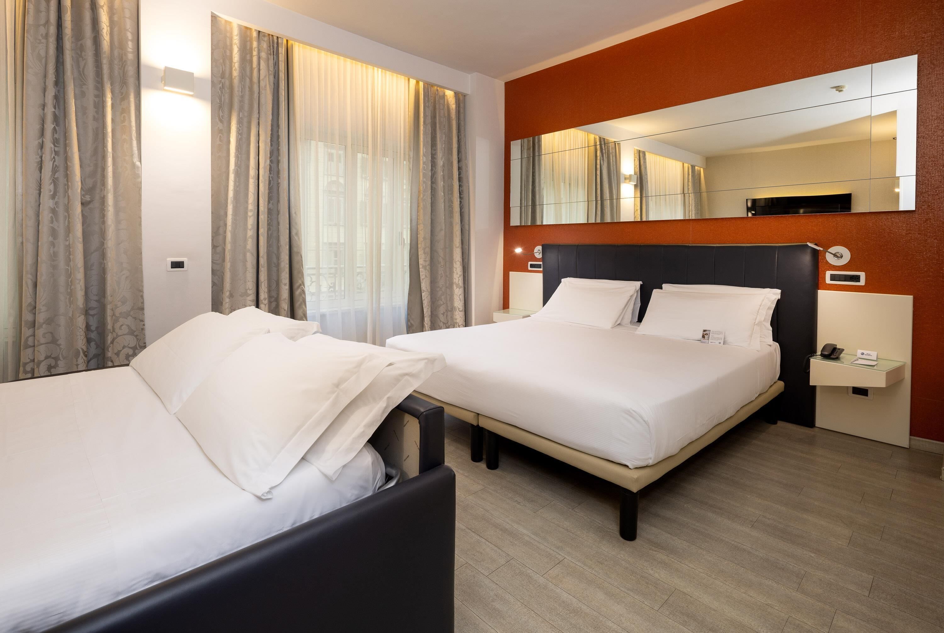 Family Room, 1 Queen Bed with Sofa bed | Down comforters, in-room safe, individually furnished, desk