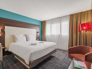 Ropa de cama de alta calidad, minibar, escritorio