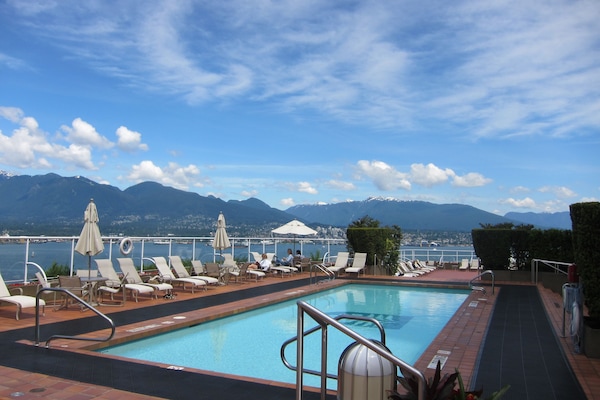 Outdoor pool, open 8:00 AM to 9:00 PM, sun loungers