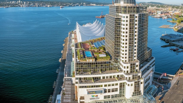 A high-rise hotel with a rooftop pool, a glass dome, and a waterfront location. - Pan Pacific Vancouver (Vancouver)