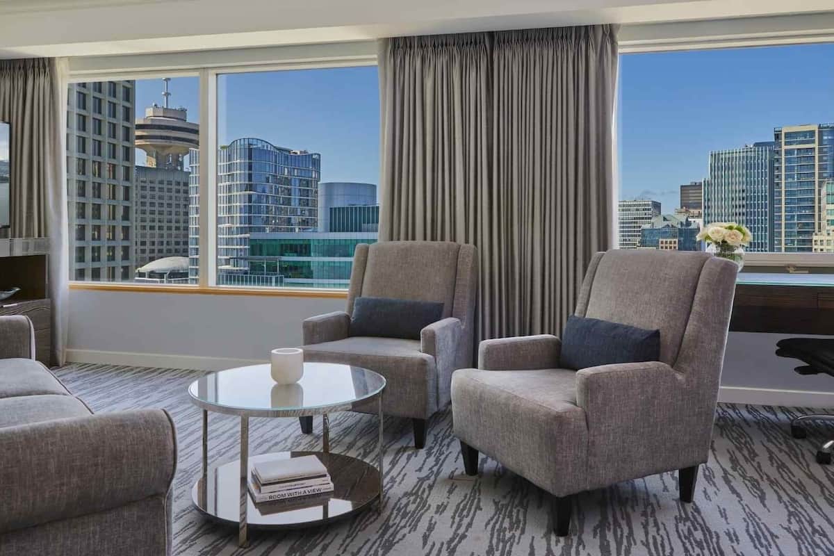 pacific club, suite, 1 king bed with sofa bed, city view | living area | 55-inch lcd tv with cable channels, tv, pay films