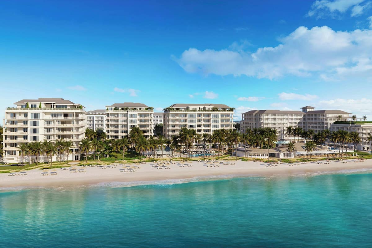 On the beach, white sand, sun loungers, beach umbrellas