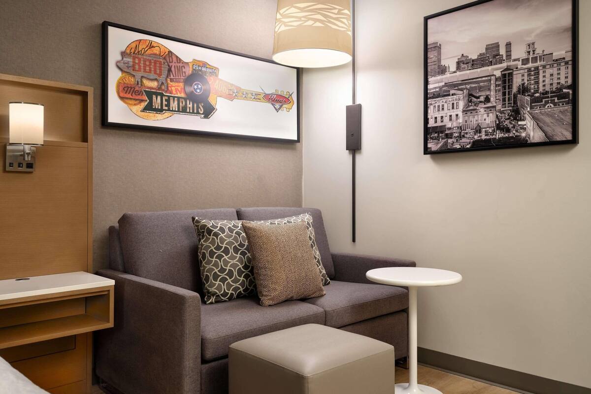 Premium bedding, desk, laptop workspace, iron/ironing board