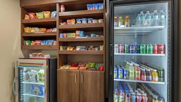 A refrigerated display case with snacks and beverages.