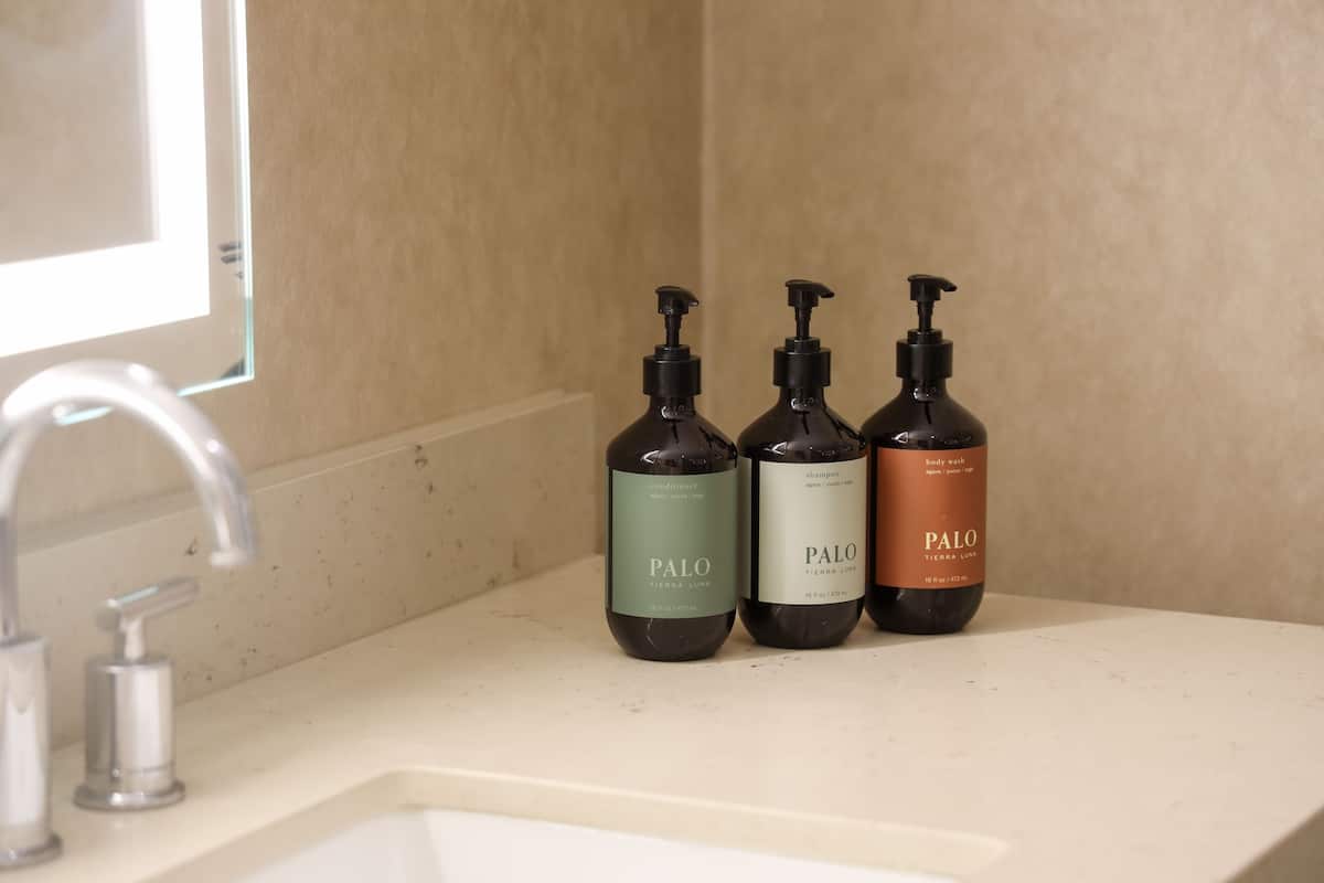 Designer toiletries, hair dryer, bathrobes, towels