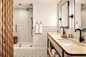 Designer toiletries, hair dryer, bathrobes, towels