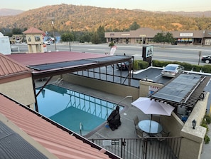 Seasonal outdoor pool, open 9:00 AM to 9:00 PM, pool loungers