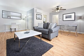 Suite, 2 Bedrooms | Living room | 37-inch LCD TV with digital channels, TV, DVD player