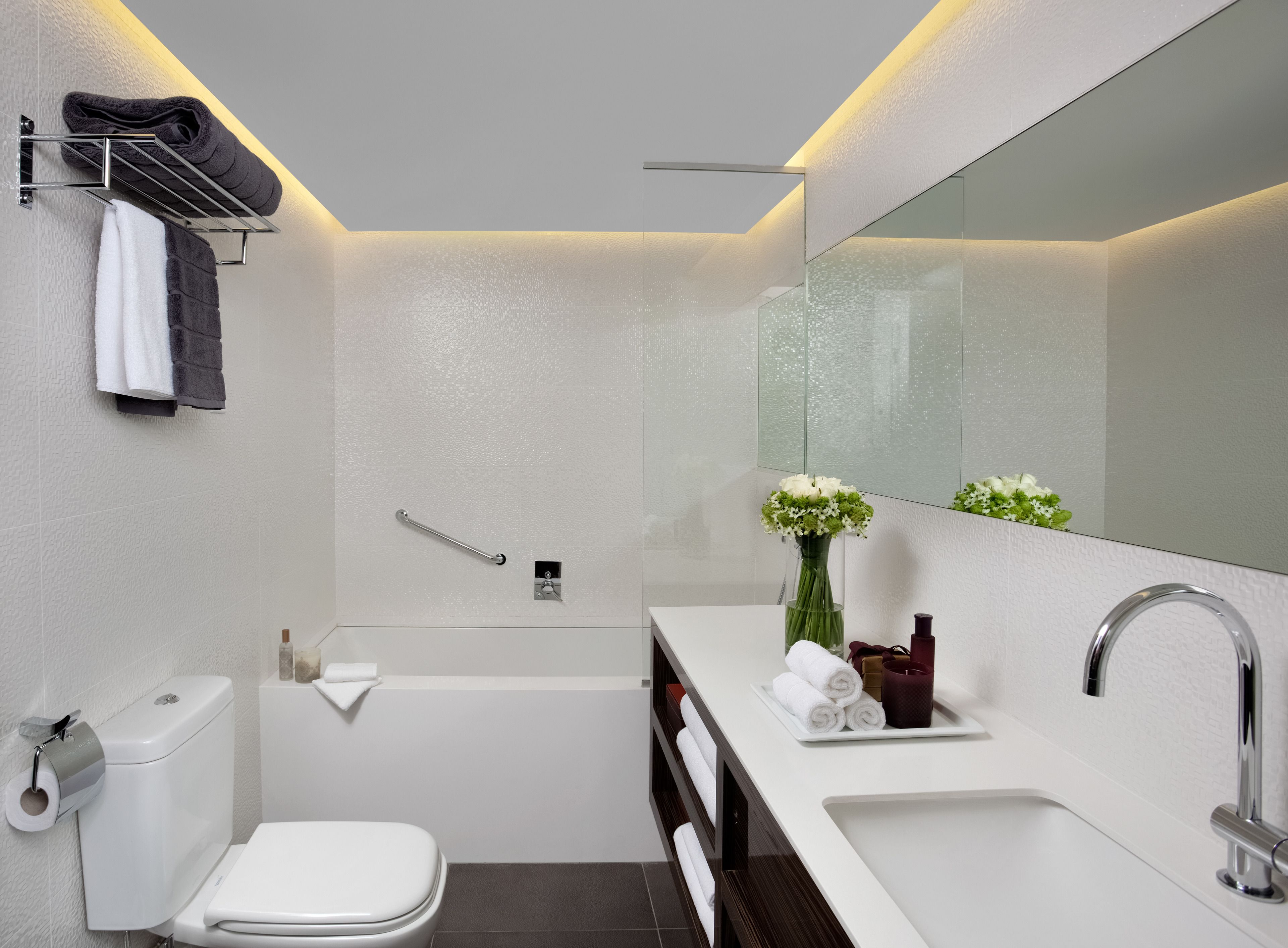 designer toiletries, hair dryer, bathrobes, slippers