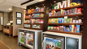 A snack display area with various packaged foods and beverages, including chips, cookies, and bottled drinks. - Hampton Inn Battle Creek (Battle Creek)