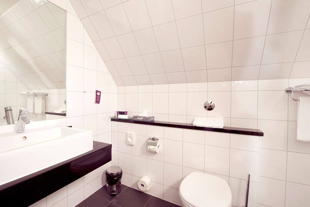 shower, eco-friendly toiletries, hair dryer, slippers