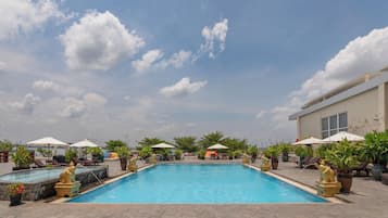 Outdoor pool, pool umbrellas, sun loungers