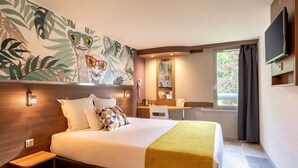 A hotel room with a bed, a desk, a chair, a TV, and a window with curtains. -  Sure Hotel by Best Western Lille Tourcoing (Bondues)