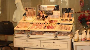 A display of various skincare and makeup products at a store named 'Jane Iredale'.