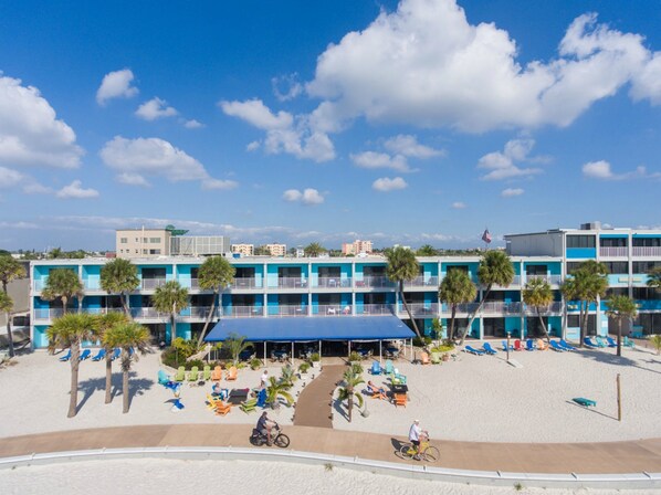 On the beach, white sand, beach towels, beach bar