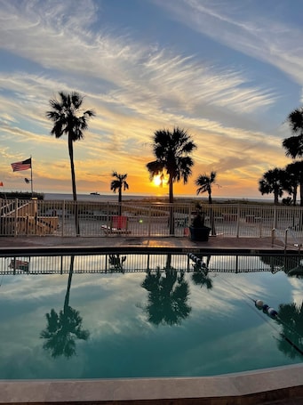 On the beach, white sand, beach towels, beach bar