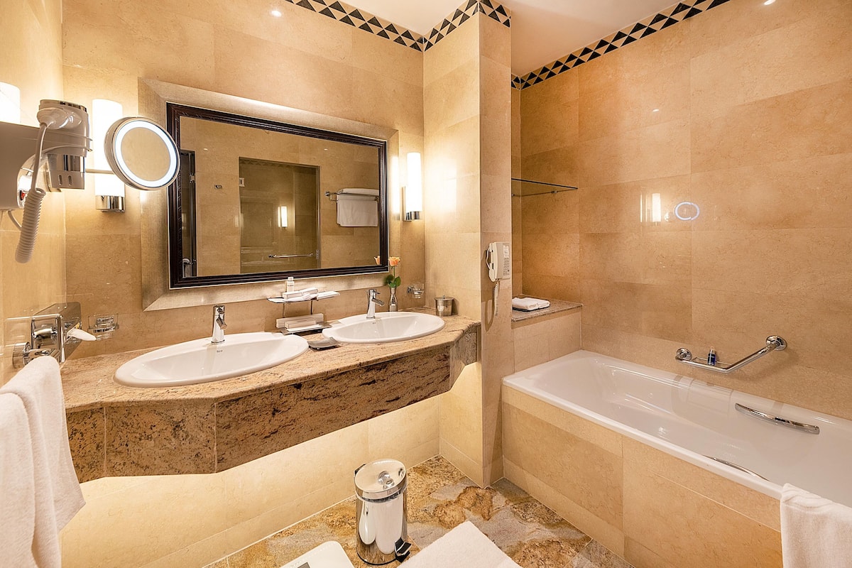 separate bathtub and shower, designer toiletries, hair dryer, bathrobes