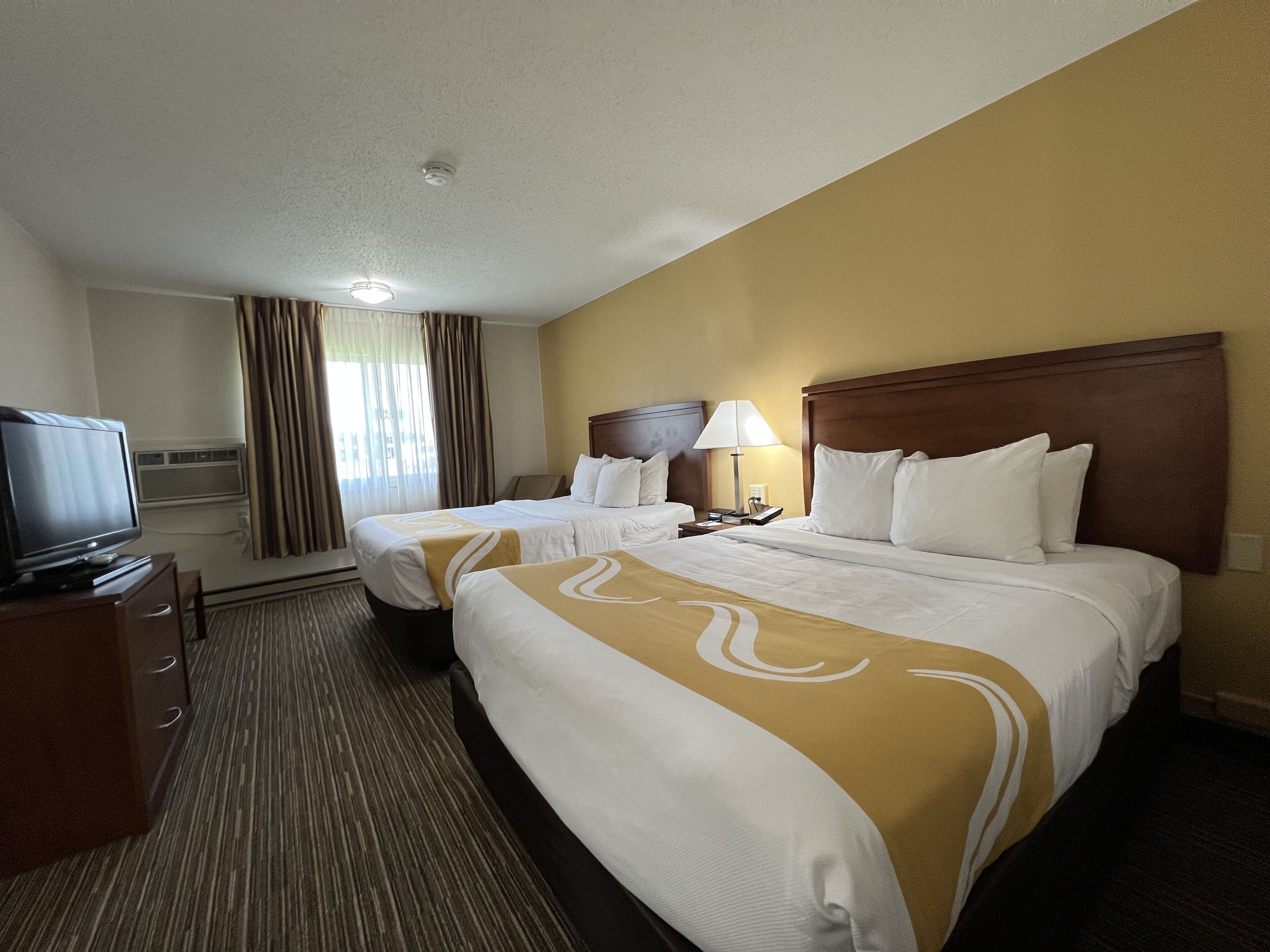 Desk, blackout drapes, iron/ironing board, free cribs/infant beds