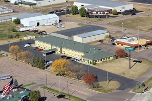 Industrial business with a flat roof and parking lot.