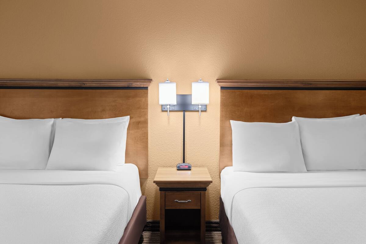 deluxe room, 2 queen beds | laptop workspace, iron/ironing board, free wifi, bed sheets