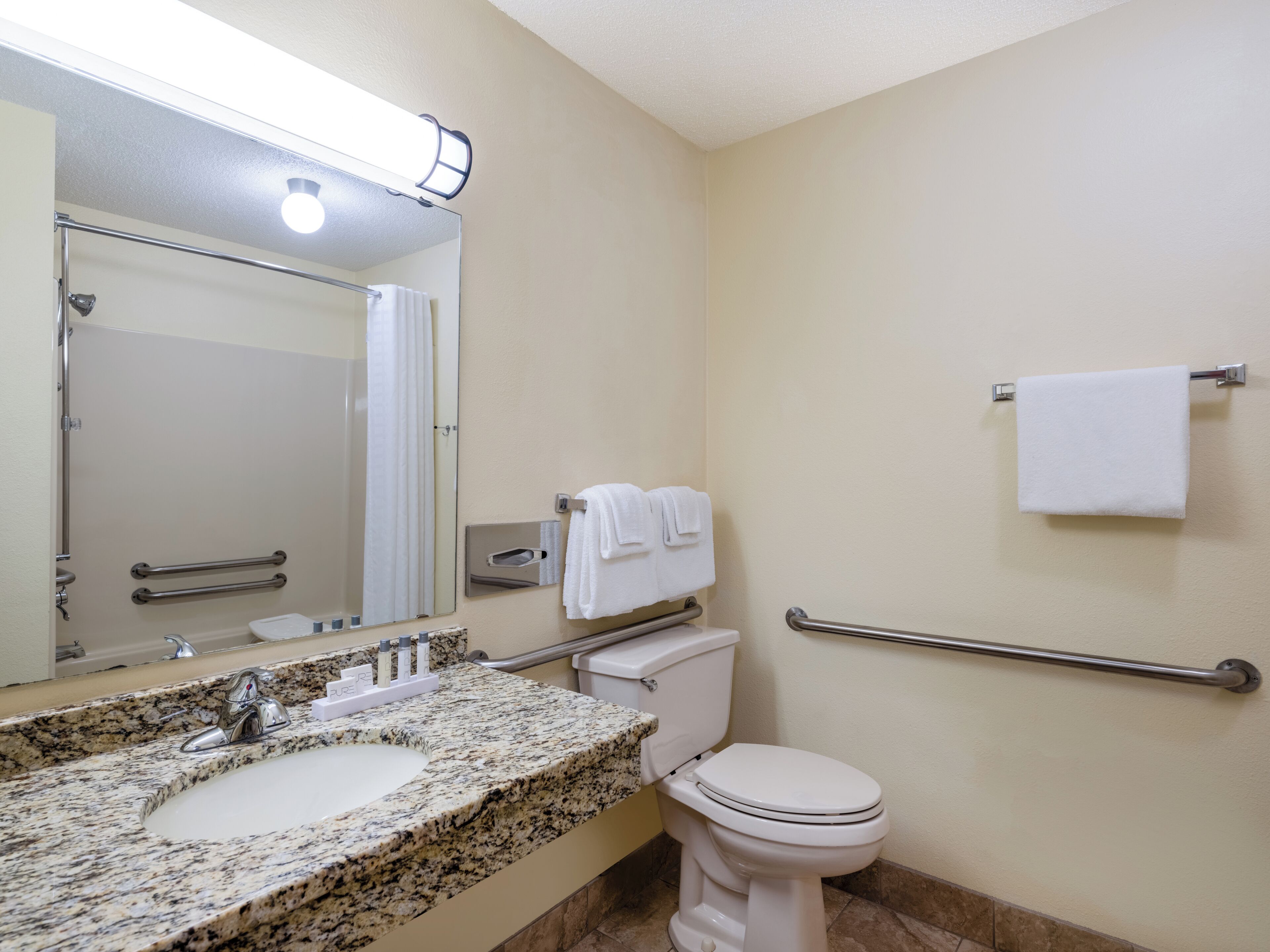 deluxe room, 1 king bed, accessible | bathroom | hair dryer, towels