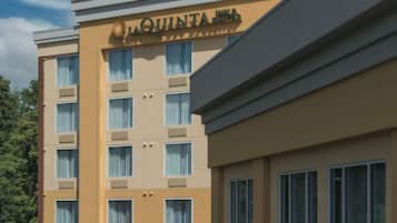 A hotel building with a sign reading "LA QUINTA INN & SUITES".