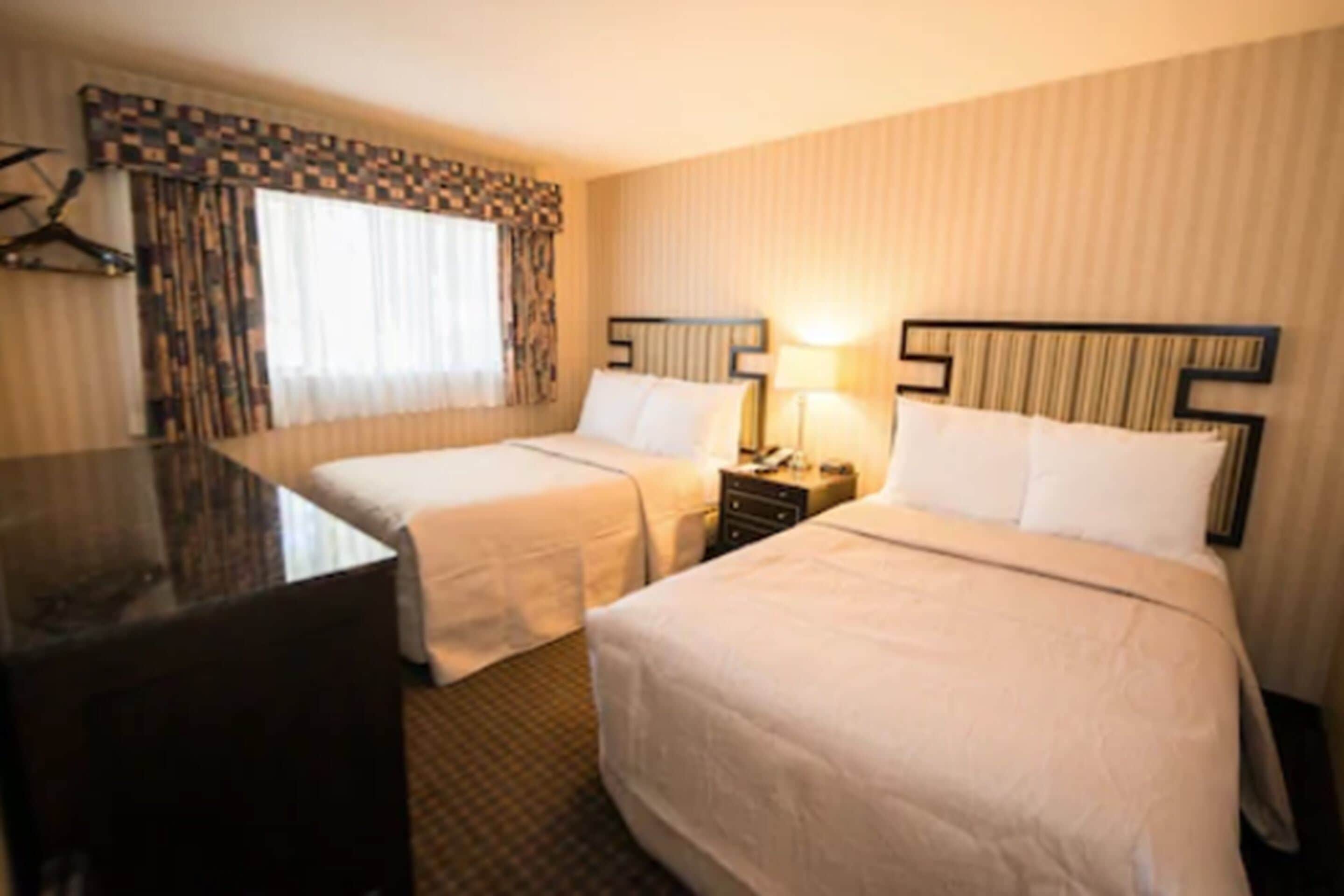 desk, blackout curtains, iron/ironing board, rollaway beds