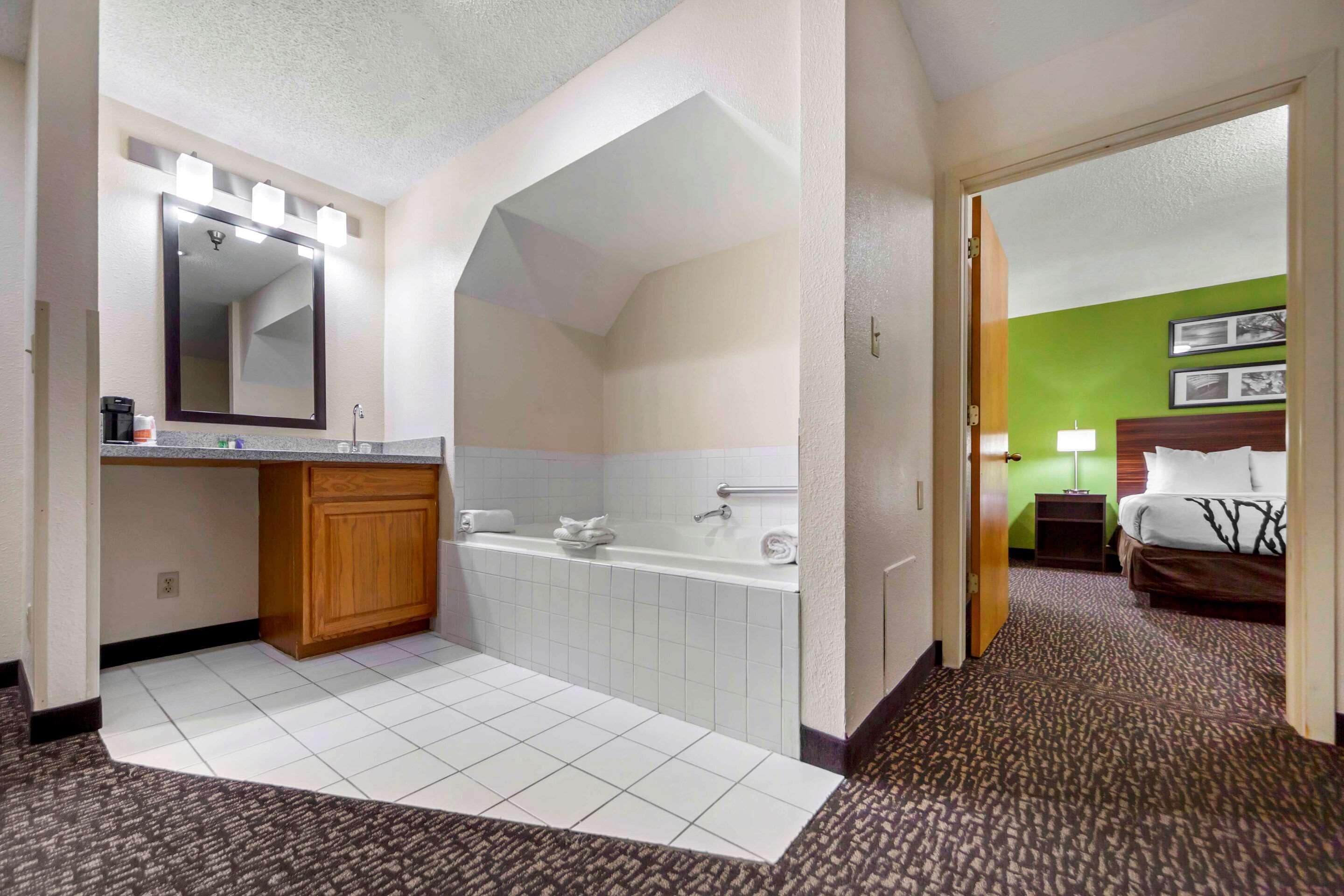 suite, 2 queen beds, non smoking | in-room safe, desk, iron/ironing board, cots/infant beds