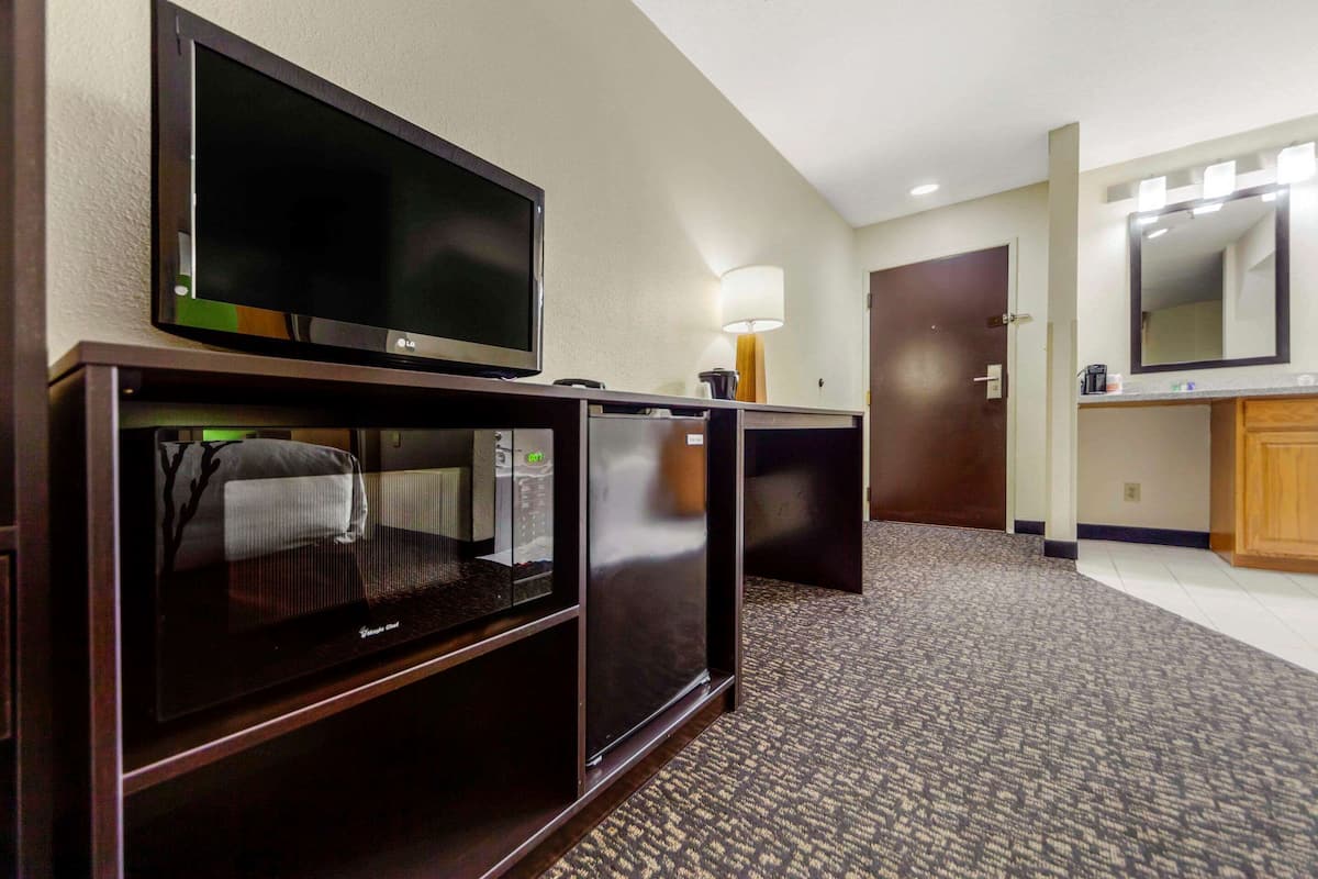 suite, 2 queen beds, non smoking | in-room safe, desk, iron/ironing board, cots/infant beds