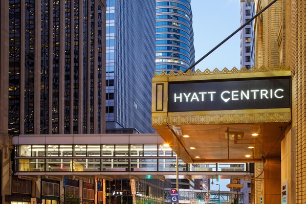 The exterior of the Hyatt Centric hotel with a prominent marquee sign, modern architecture, and a glass facade. - Hyatt Centric Downtown Minneapolis (Minneapolis)