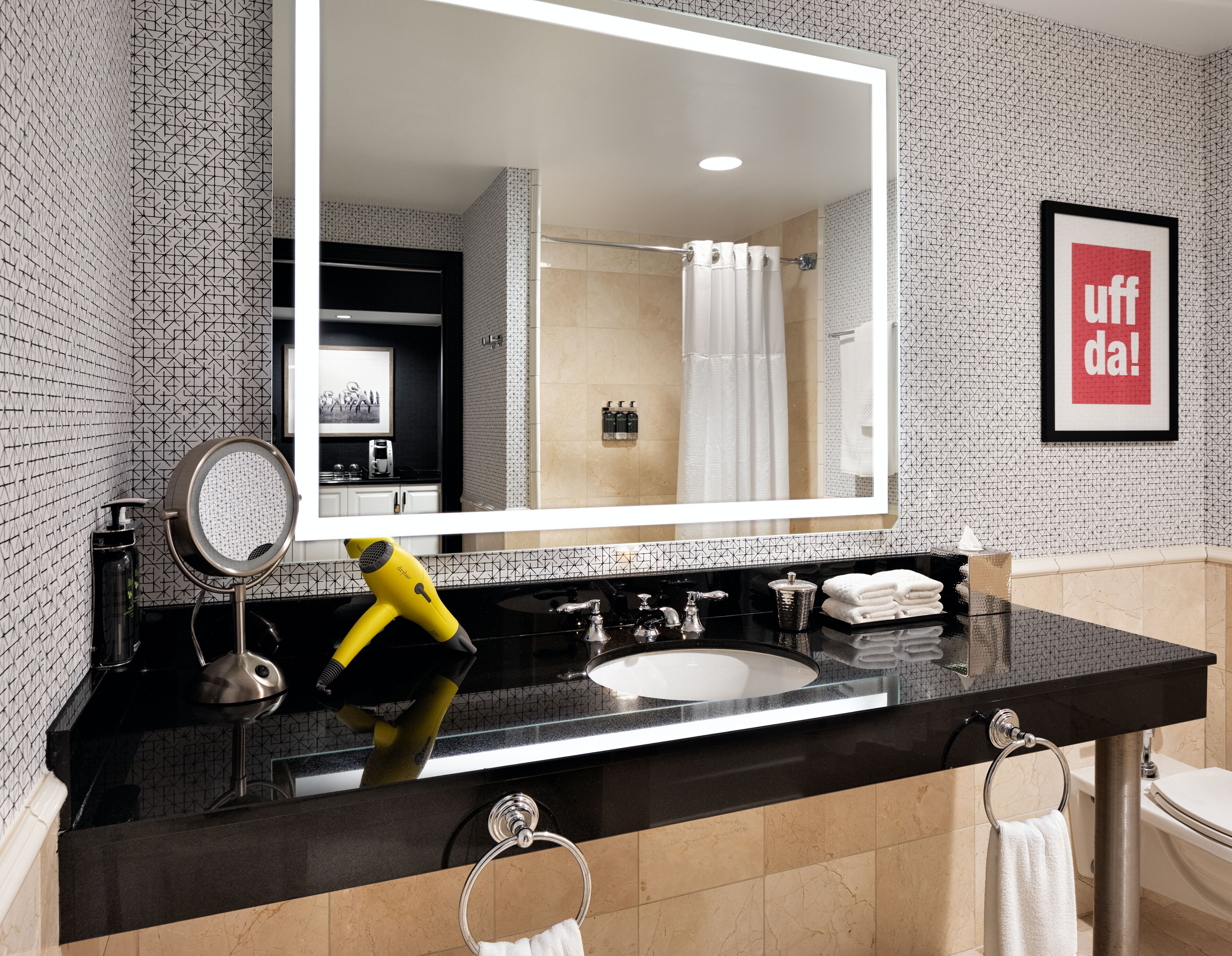 combined shower/bathtub, designer toiletries, hair dryer, bathrobes