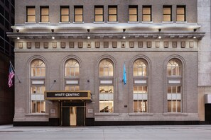 A brick building with arched windows and a marquee sign reading "HYATT CENTRIC". - Hyatt Centric Downtown Minneapolis (Minneapolis)