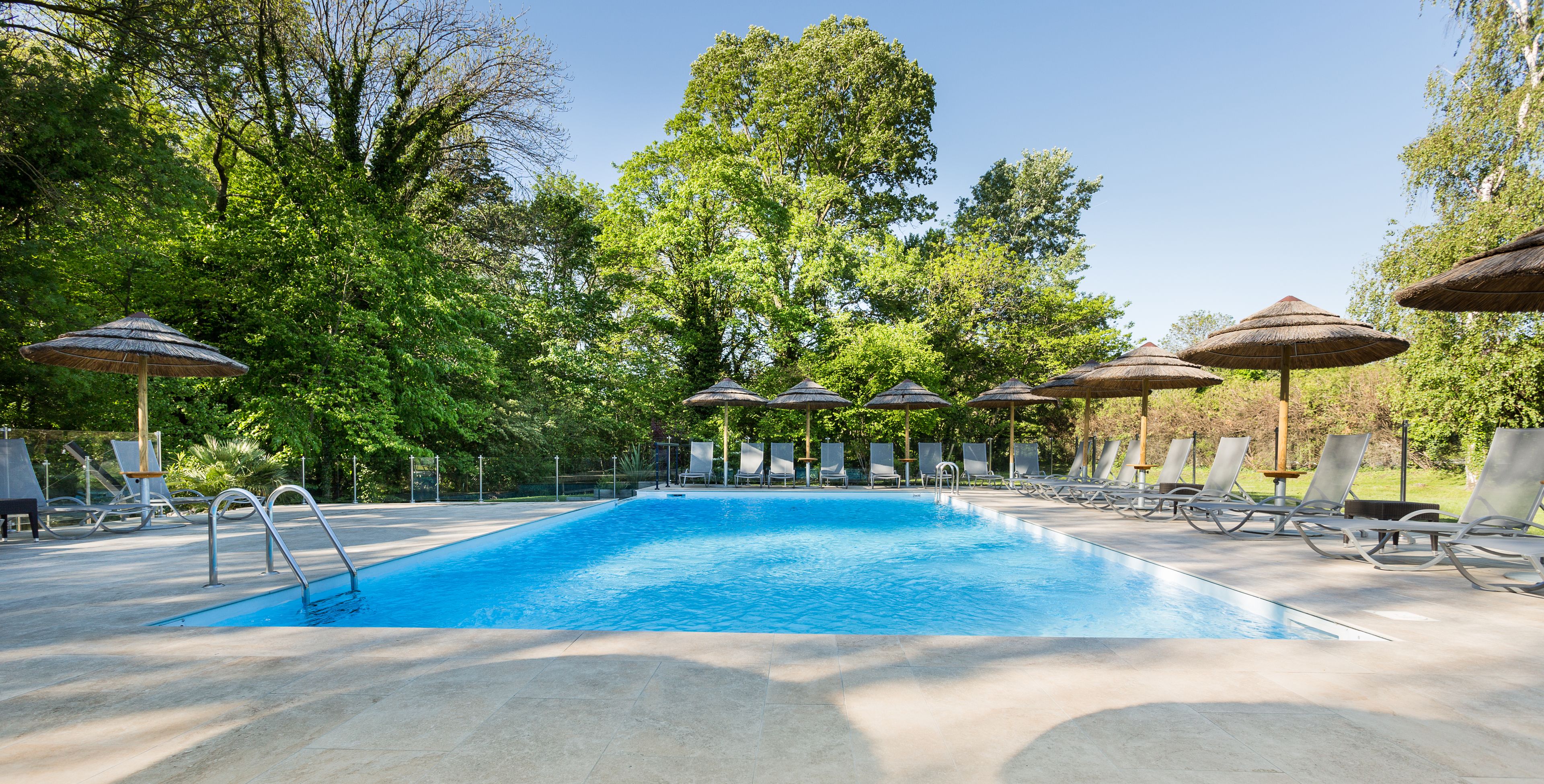 seasonal outdoor pool, open 9:00 am to 10:00 pm, pool umbrellas
