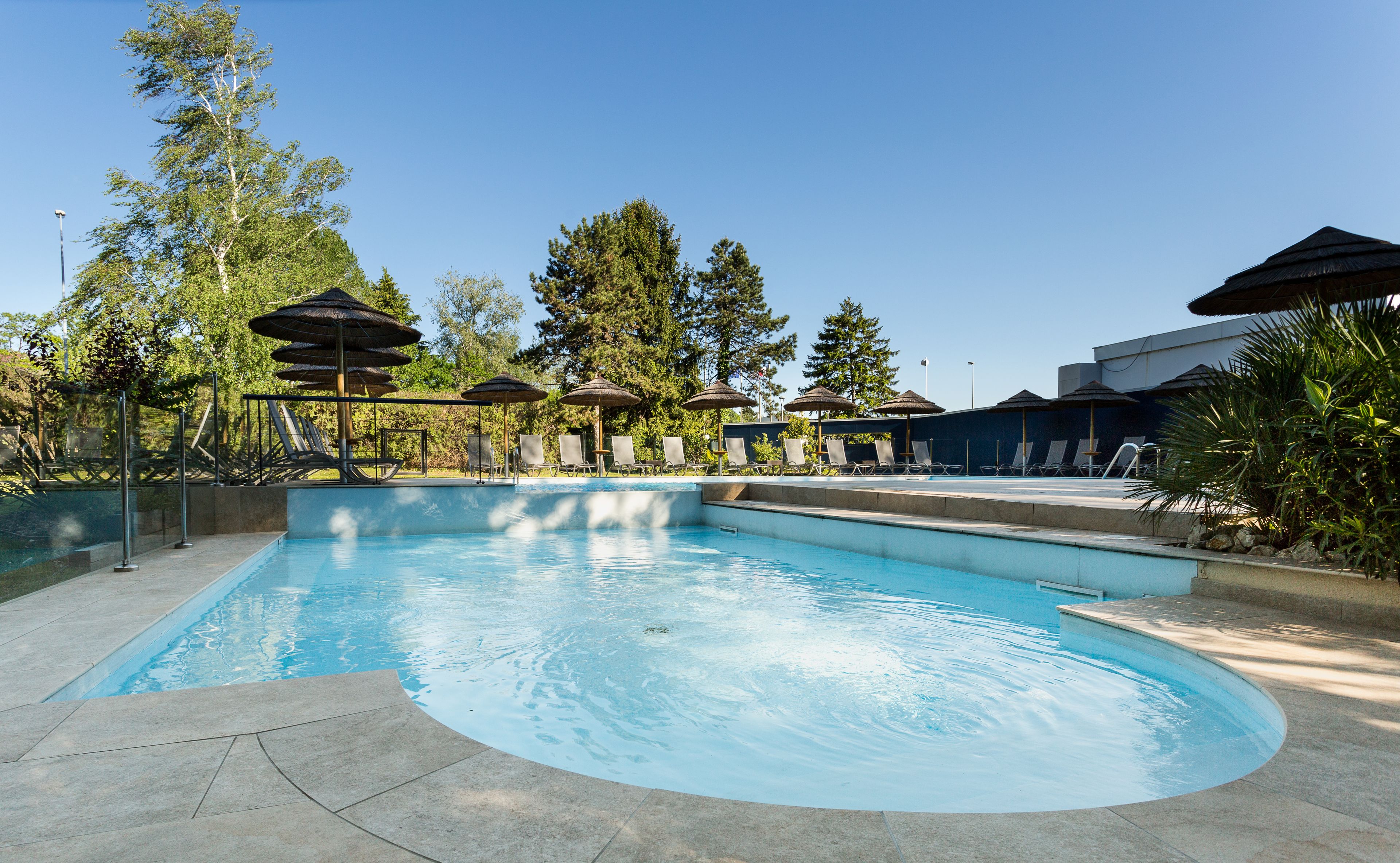 seasonal outdoor pool, open 9:00 am to 10:00 pm, pool umbrellas