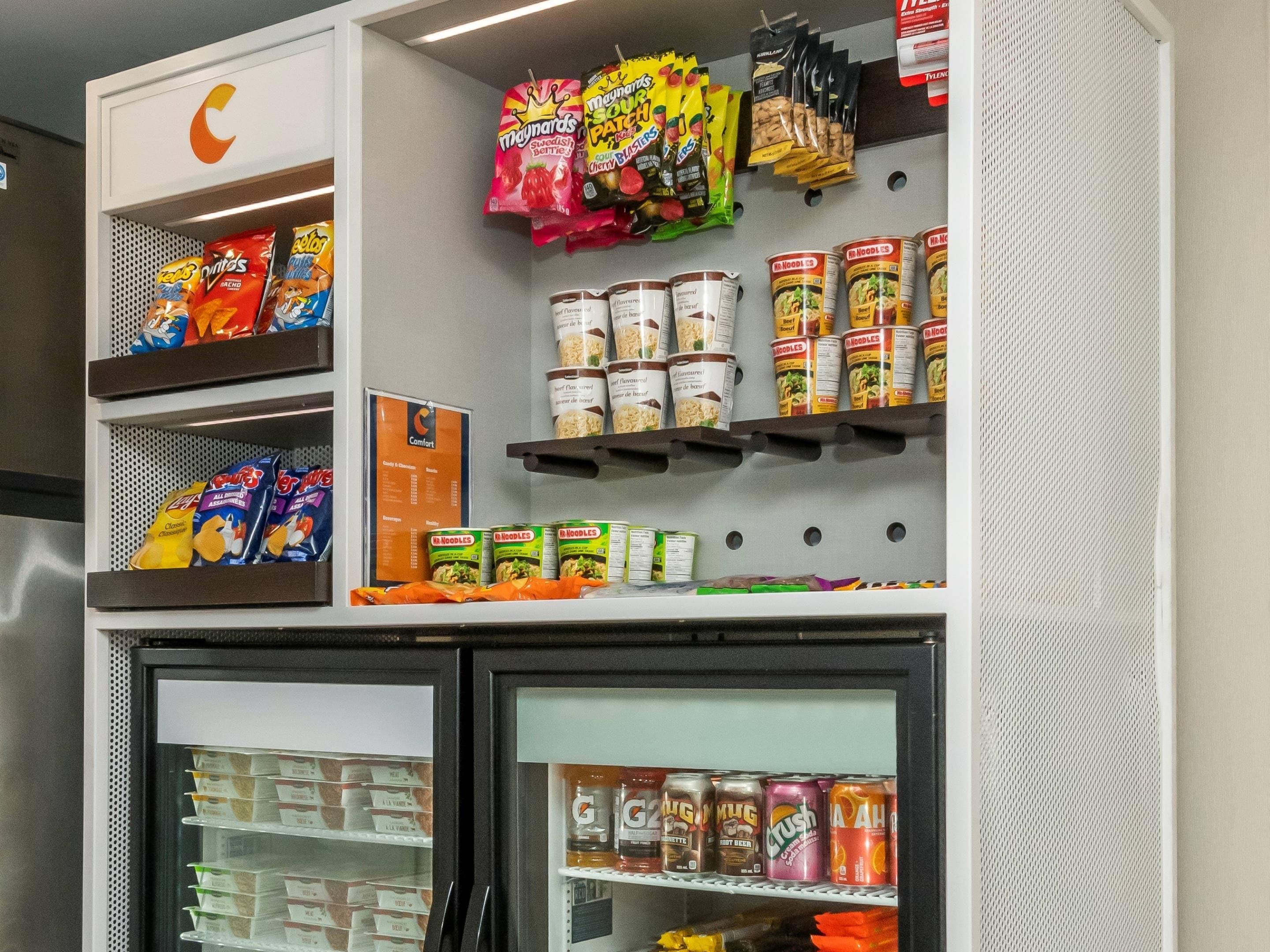 A snack and beverage section with various packaged goods and cans.