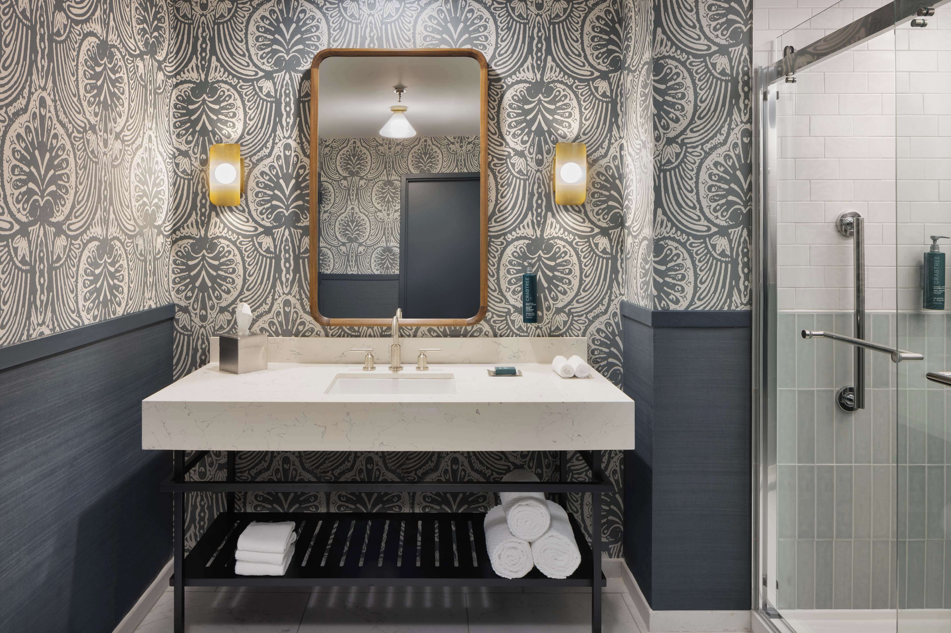 two room hospitality suite, 1 king bed | bathroom shower