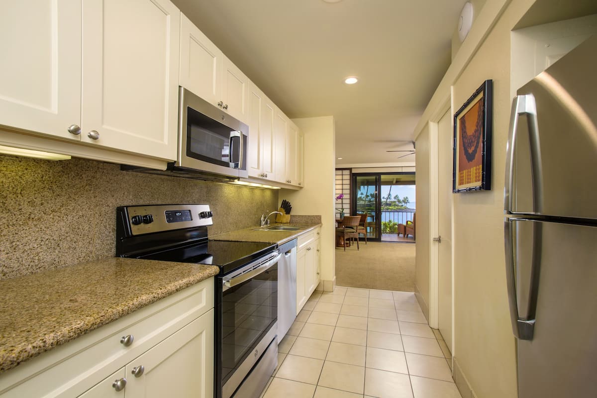 deluxe room, 1 king bed | private kitchen | fridge, coffee/tea maker, high chair