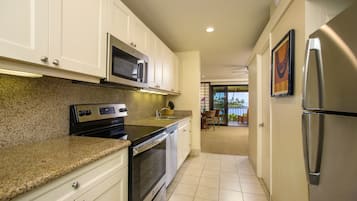 Habitació Deluxe, 1 llit de matrimoni gran | Cuina privada | Frigorífic, cafetera i tetera i trona
