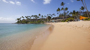 On the beach, sun-loungers, beach towels, snorkelling