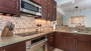 Deluxe Condo, 2 Bedrooms, Garden View | Private kitchen | Full-sized fridge, microwave, oven, stovetop