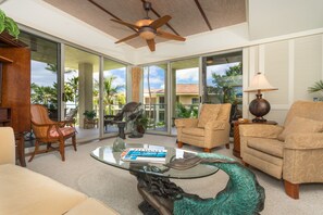 Deluxe Condo, 2 Bedrooms, Garden View | Living area | 32-inch TV with cable channels