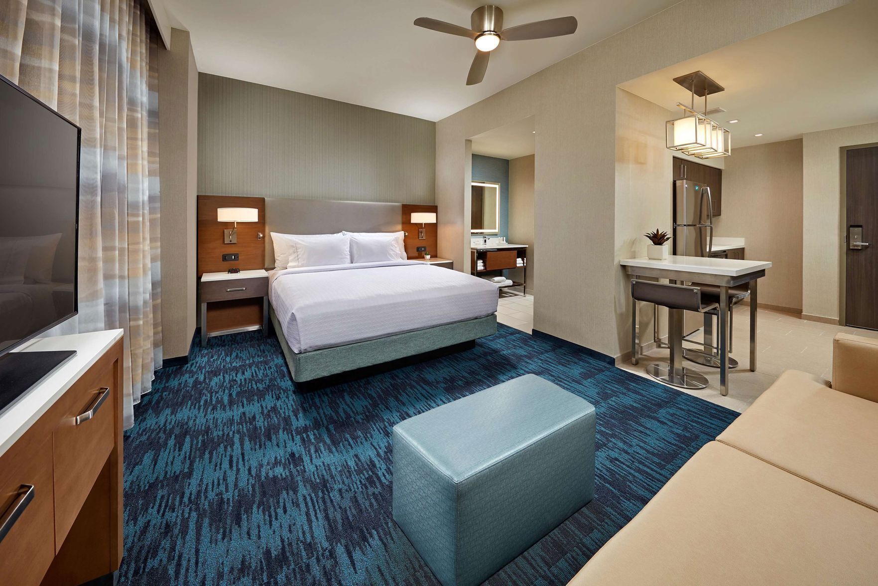 Hypo-allergenic bedding, desk, laptop workspace, blackout drapes